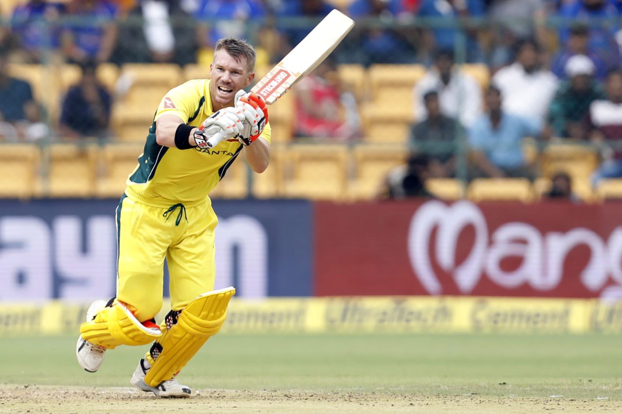 A helmetless David Warner clips the ball through the on side