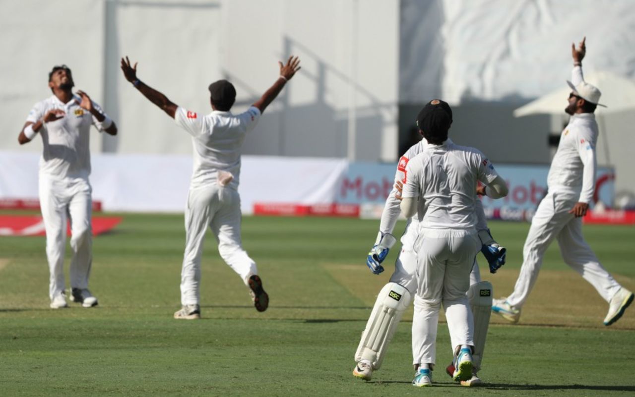 Suranga Lakmal and the Sri Lanka players celebrate a wicket, Pakistan v Sri Lanka, 2nd Test, Dubai, 3rd day, October 8, 2017