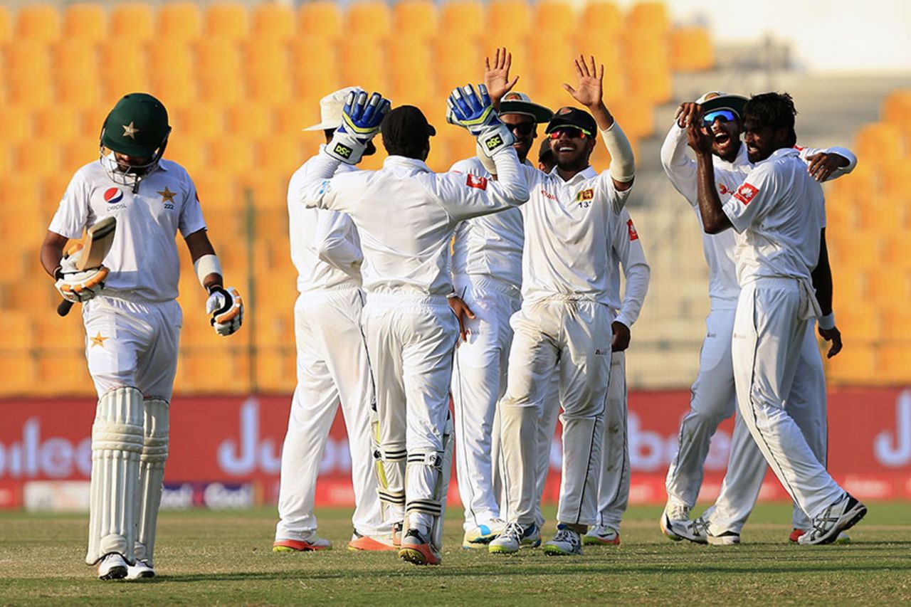 Sri Lanka players celebrate the wicket of Babar Azam, Pakistan v Sri Lanka, 1st Test, Abu Dhabi, 3rd day, September 30, 2017