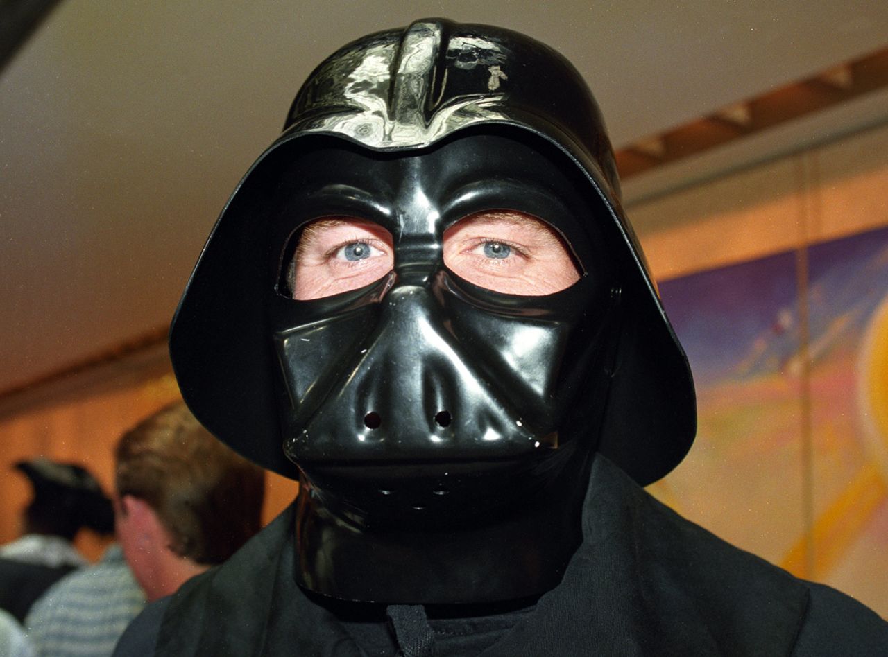 Shaun Udal wears a Darth Vader costume at a traditional fancy dress luncheon for the England cricket team at Christmas, December 25, 1994