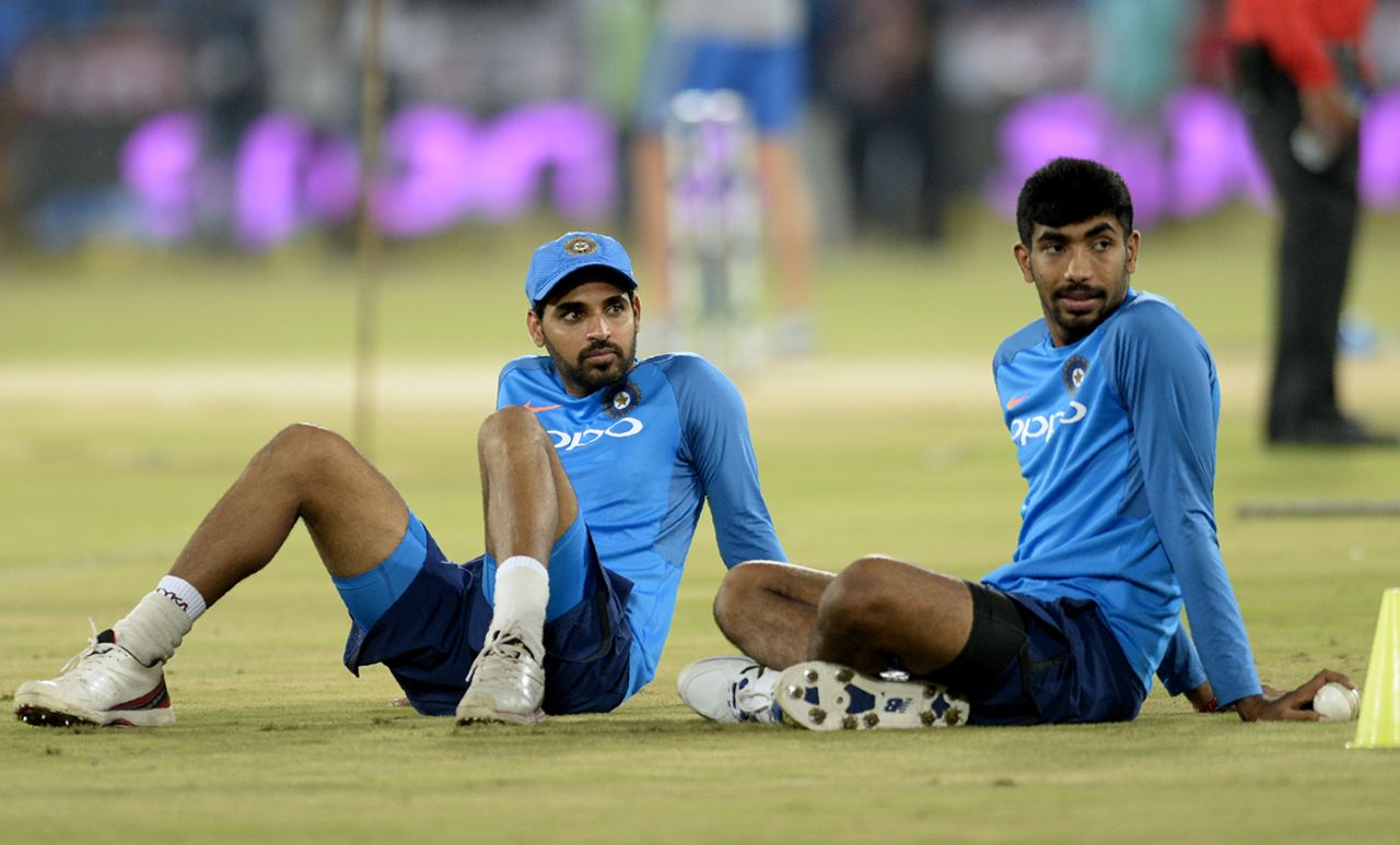 Bhuvneshwar Kumar and Jasprit Bumrah wait for proceedings to begin, India v Australia, 3rd T20I, Hyderabad, October 13, 2017