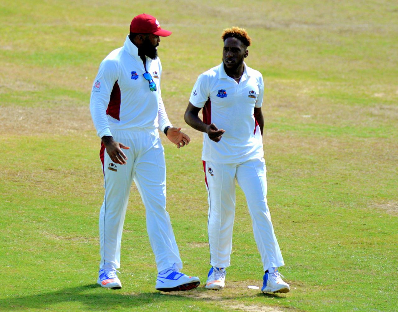 Chesney Hughes chats with Jeremiah Louis, who claimed nine wickets in the game and scored an unbeaten 62, Barbados v Leeward Islands, Regional Four-Day Tournament, Bridgetown, 2nd day, November 2, 2017