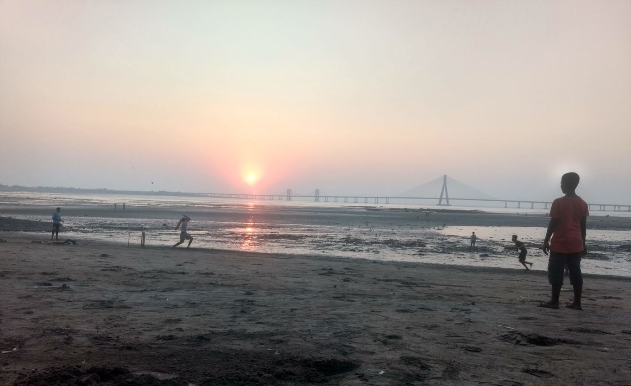 <b>Ajinkya Jain</b>: Sun, sand, and the famous sea link enhance the setting for this game of cricket being played during low tide in Mumbai's Mahim Bay