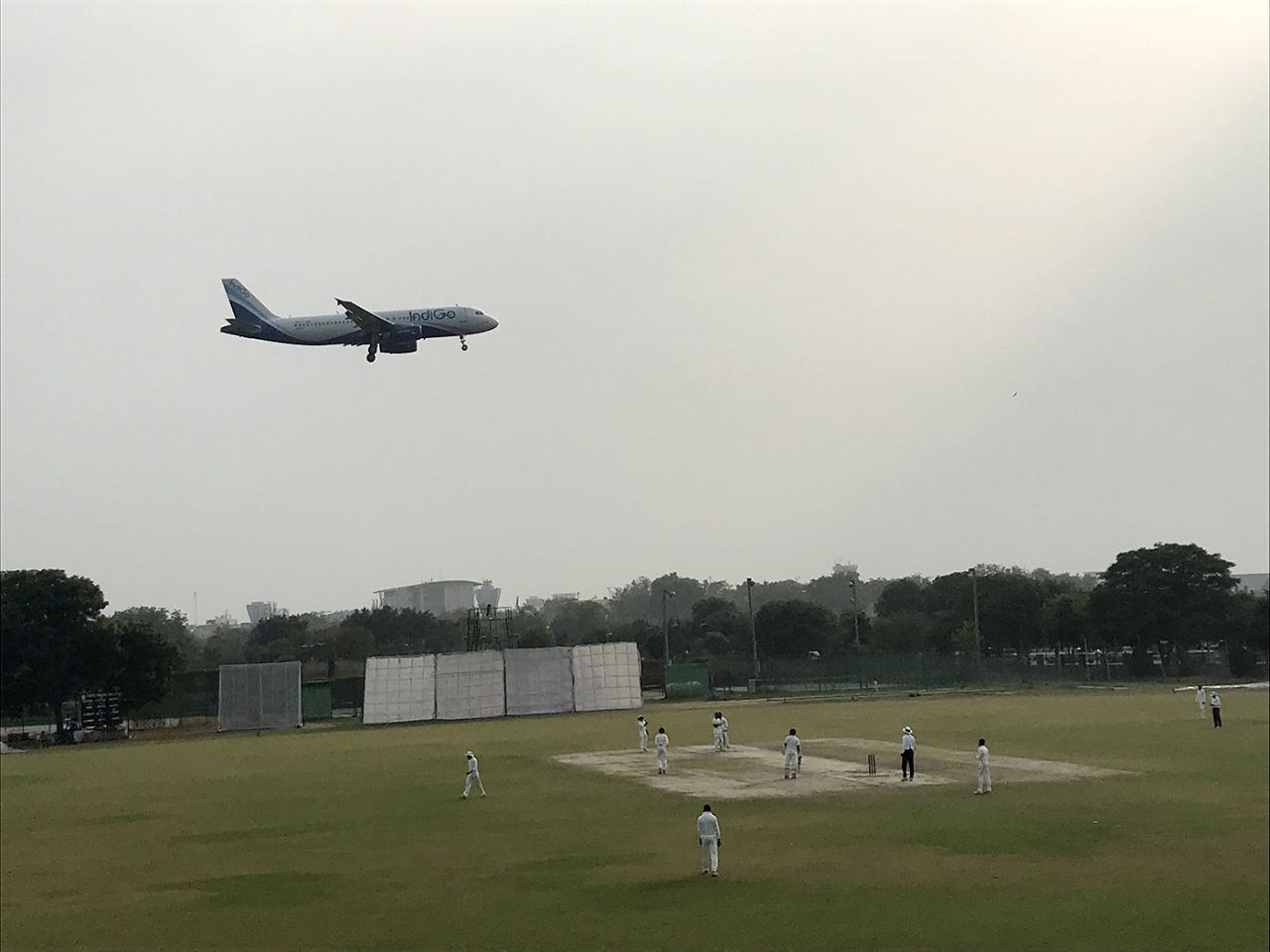 An aircraft flies over the Palam ground in Delhi, during the Delhi v Maharashtra Ranji Trophy game, Ranji Trophy 2017-18, Group A, November 17, 2017