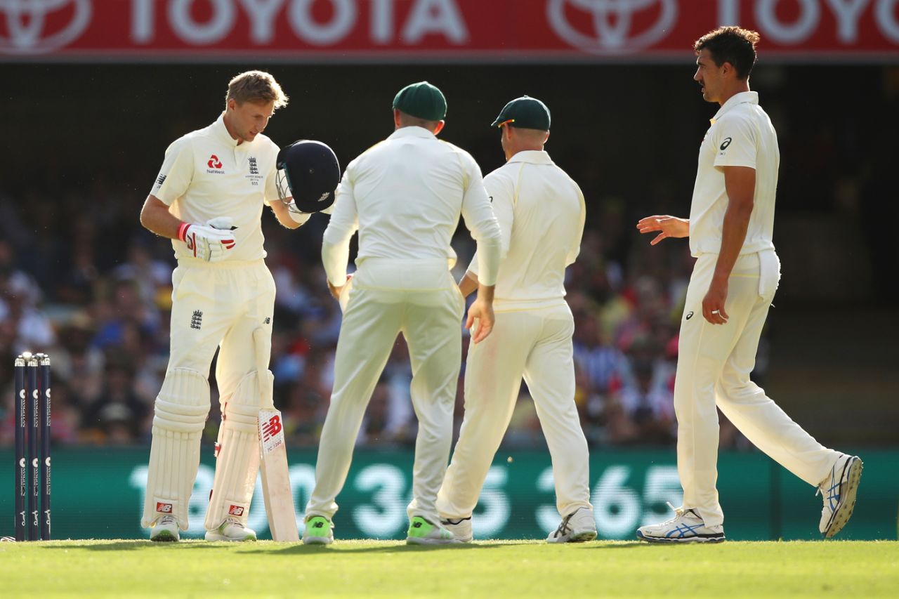 The Australian players rush in to check in on Joe Root after he copped a Mitchell Starc bouncer on his helmet, Australia v England, The Ashes 2017-18, 1st Test, Brisbane, 3rd day, November 25, 2017