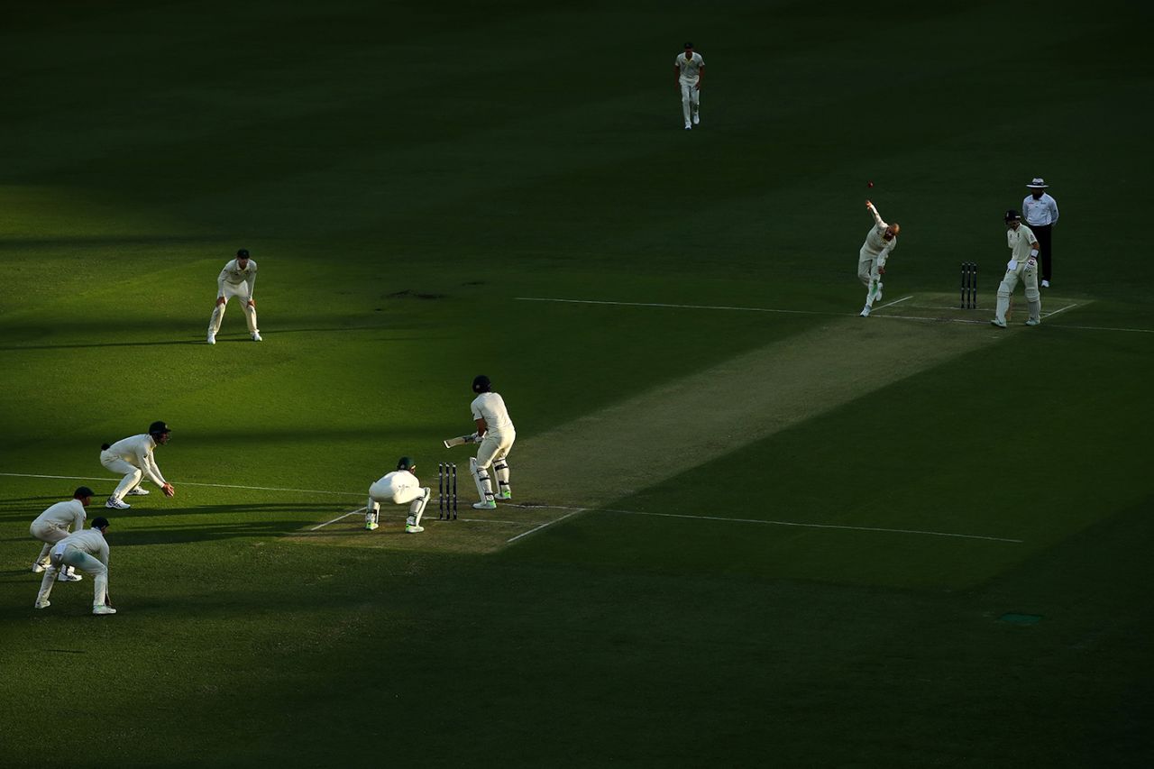 Nathan Lyon bowls to Dawid Malan late on day one with shadows falling across the pitch, Australia v England, 1st Test, The Ashes 2017-18, 1st day, Brisbane, November 23, 2017