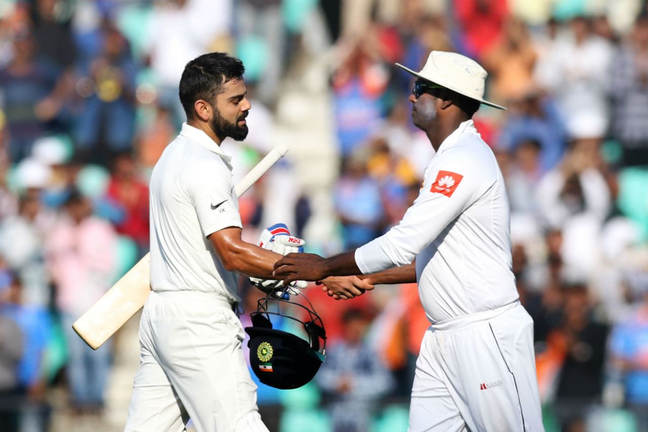 Virat Kohli is congratulated by Angelo Mathews after his fifth double century, India v Sri Lanka, 2nd Test, Nagpur, 3rd day, November 26, 2017