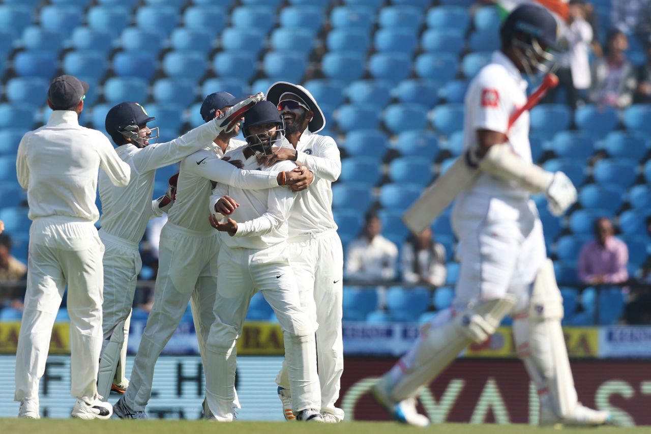 Murali Vijay is mobbed by his team-mates after he held on to Dimuth Karunaratne's catch at short-leg, India v Sri Lanka, 2nd Test, Nagpur, 4th day, November 27, 2017