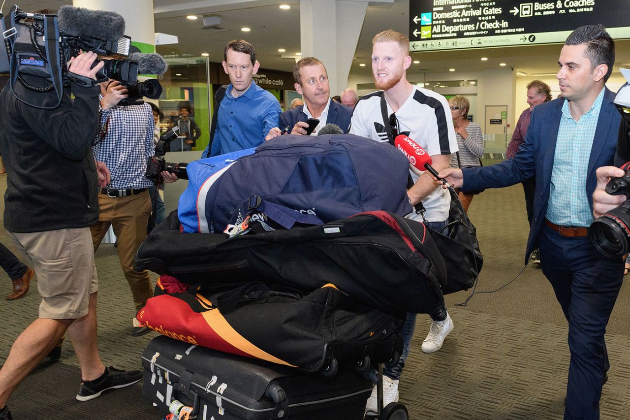 Ben Stokes walks through the airport surrounded by media, November 28, 2017