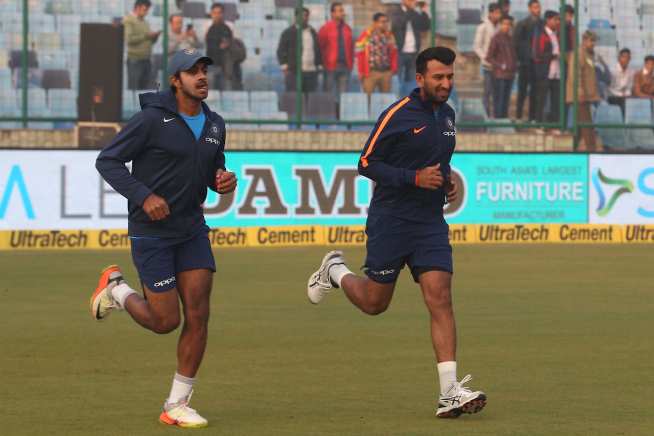 Vijay Shankar and Cheteshwar Pujara jog before the first day's play, India v Sri Lanka, 3rd Test, Delhi, 1st day, December 2, 2017