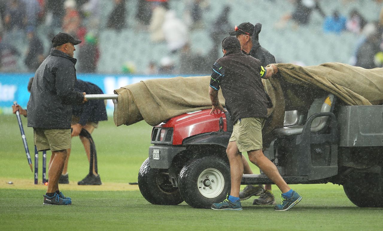 Ground staff hurry to get the square covered following showers, Australia v England, 2nd Test, The Ashes 2017-18, 1st day, Adelaide, December 2, 2017