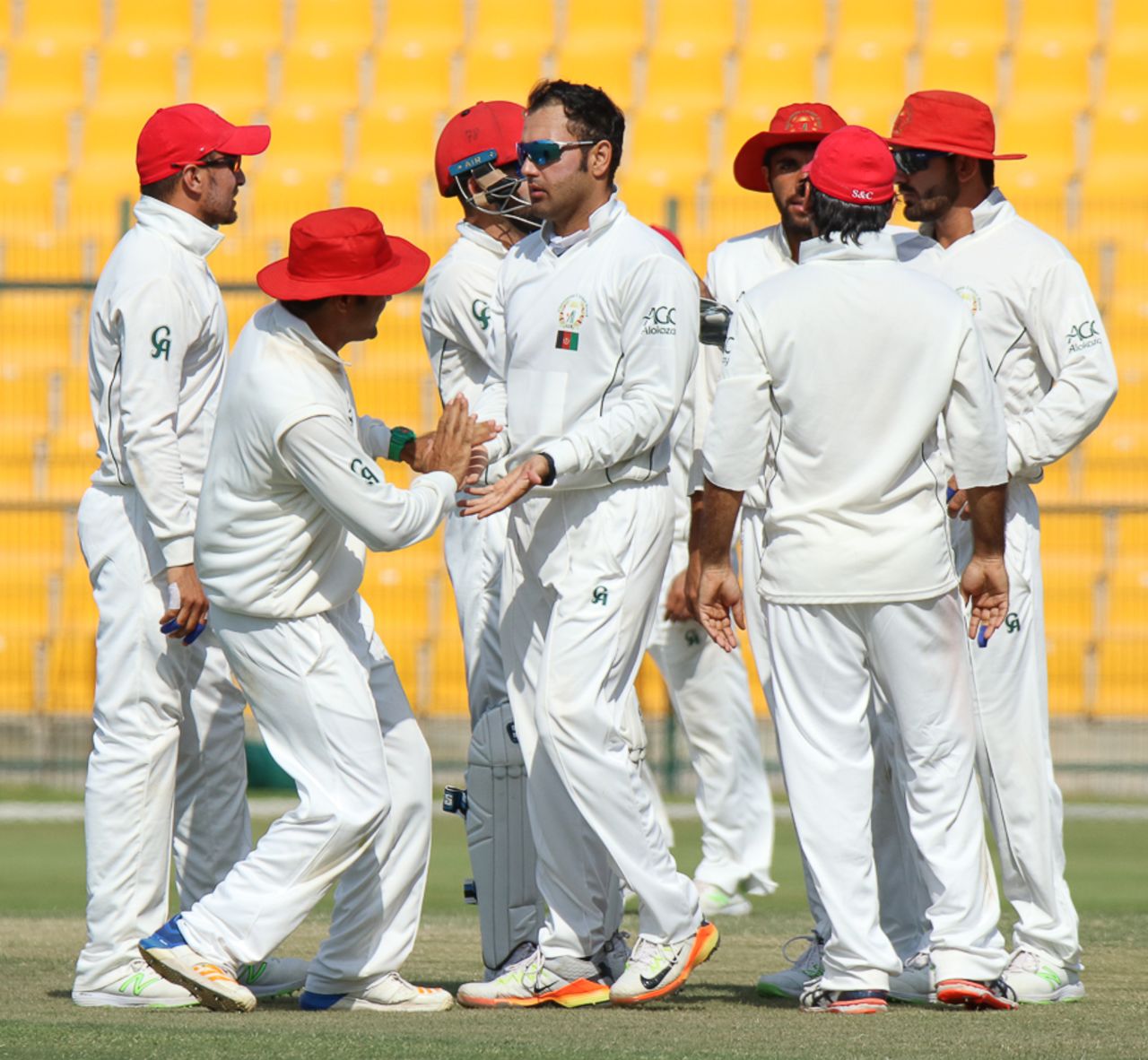 Mohammad Nabi gets congratulated for taking a wicket, UAE v Afghanistan, 2015-17 Intercontinental Cup, 4th day, Abu Dhabi, December 2, 2017