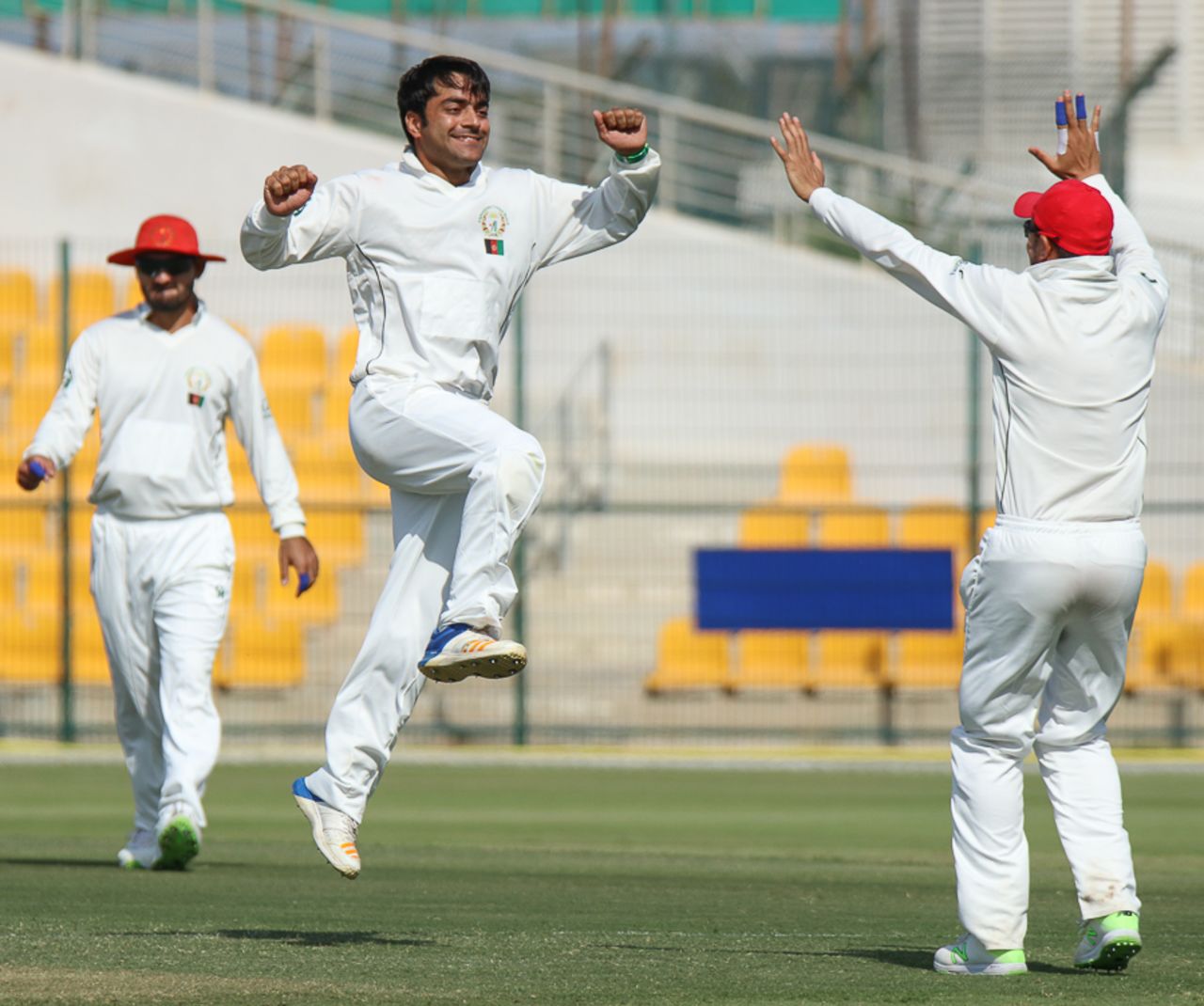 Rashid Khan leaps in the air to celebrate a five-wicket haul, UAE v Afghanistan, 2015-17 Intercontinental Cup, 4th day, Abu Dhabi, December 2, 2017