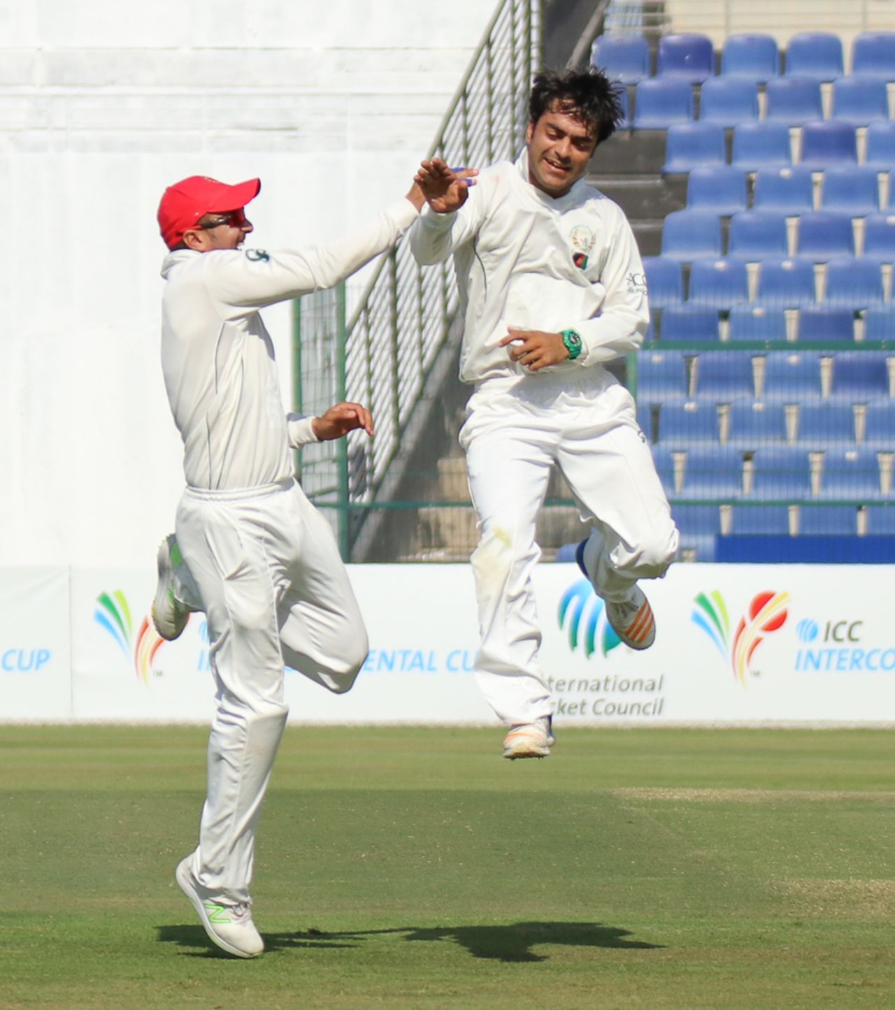 Rashid Khan high fives Nasir Jamal after another wicket, UAE v Afghanistan, 2015-17 Intercontinental Cup, 4th day, Abu Dhabi, December 2, 2017