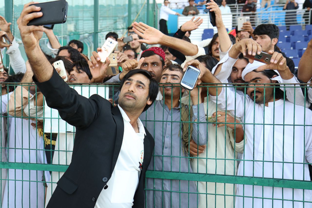 Captain Asghar Stanikzai celebrates by taking selfies with the fans, UAE v Afghanistan, 2015-17 Intercontinental Cup, 4th day, Abu Dhabi, December 2, 2017