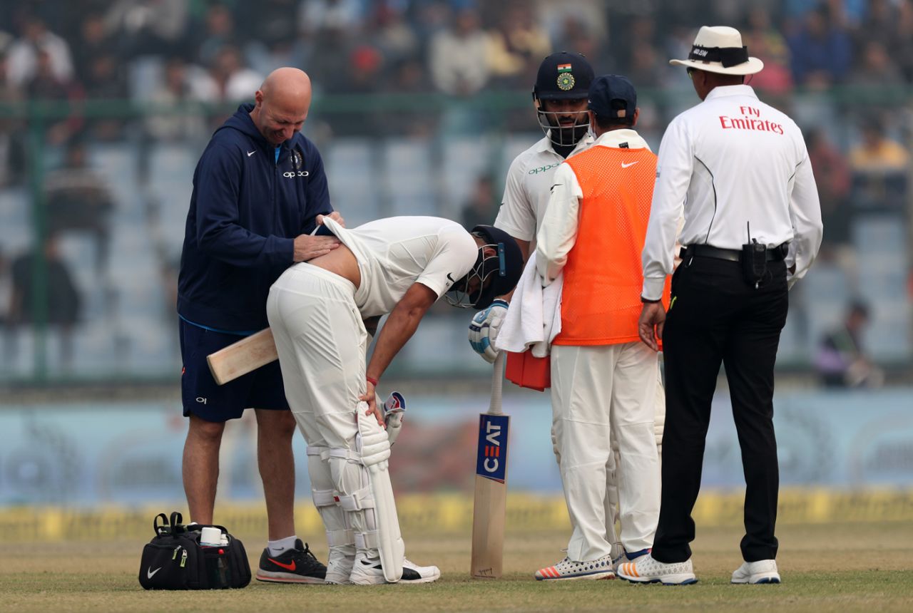 Virat Kohli receives medical assistance for his back, India v Sri Lanka, 3rd Test, Delhi, 2nd day, December 3, 2017