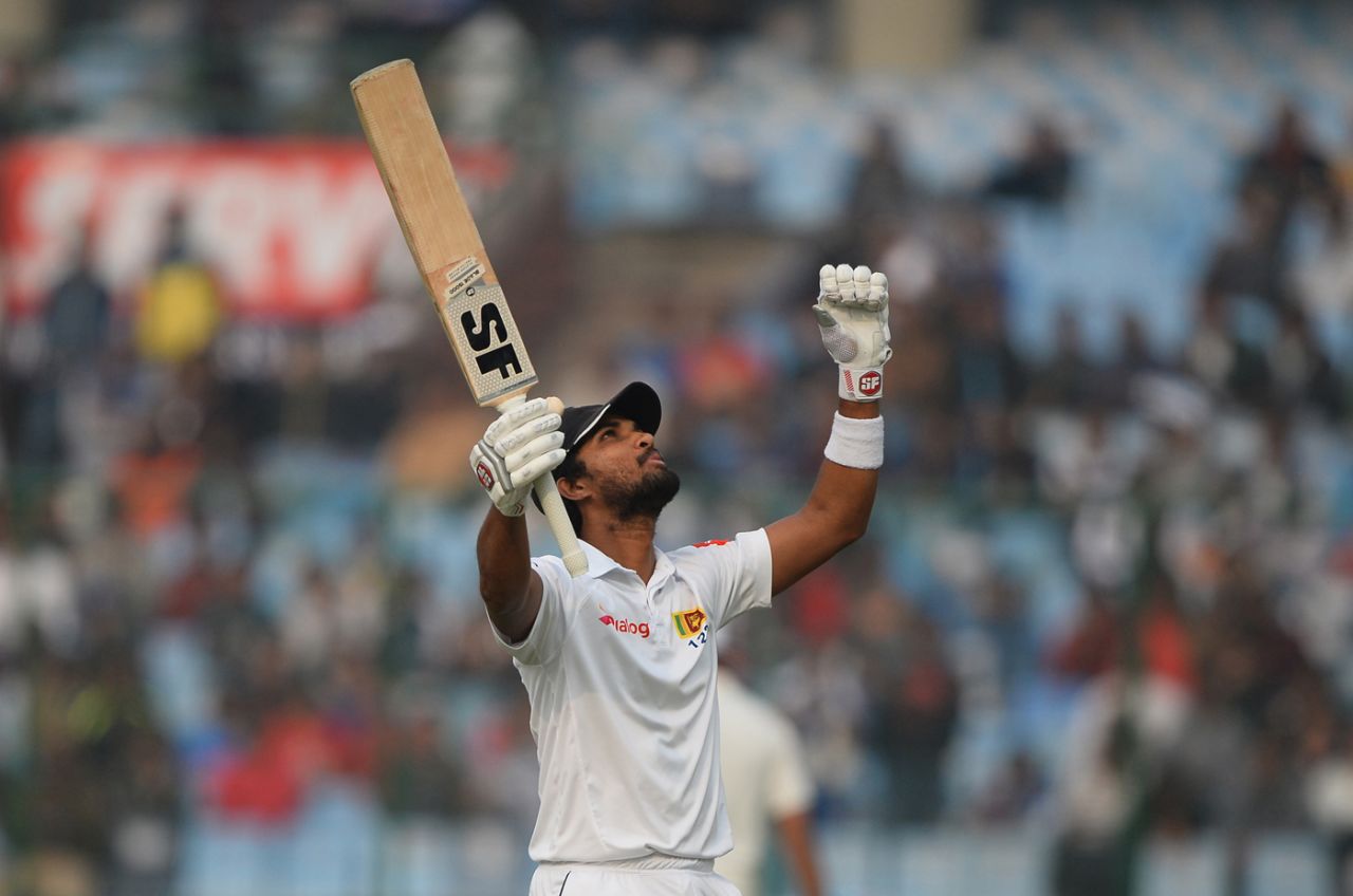 Dinesh Chandimal raises his bat after getting to his ton, India v Sri Lanka, 3rd Test, Delhi, 3rd day, December 4, 2017