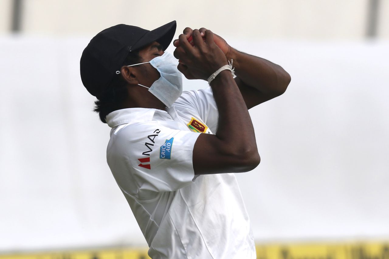A masked Lakshan Sandakan pouches the catch of Ajinkya Rahane near the boundary, India v Sri Lanka, 3rd Test, Delhi, 4th day, December 5, 2017
