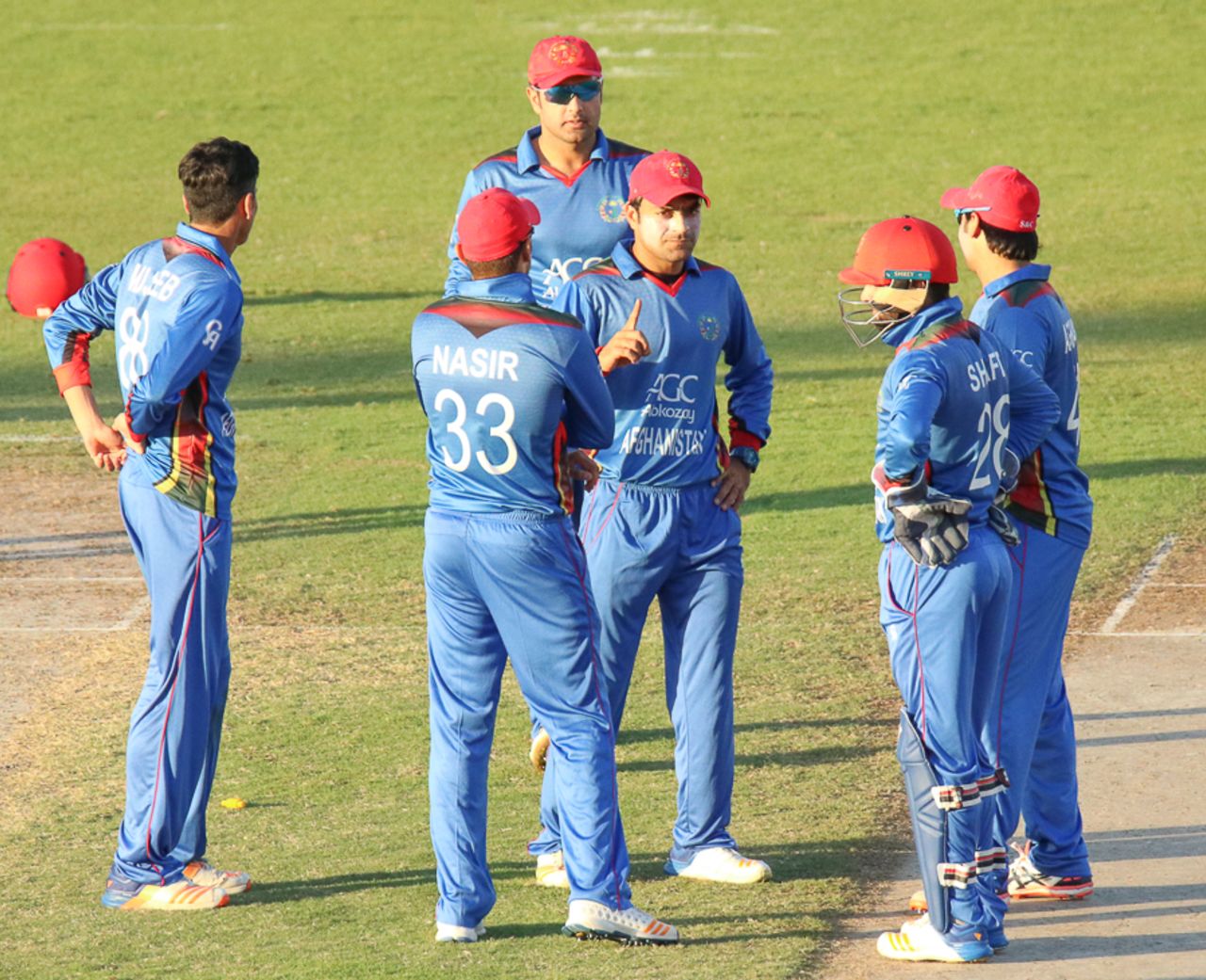 Rashid Khan gets word from the dressing room that a stumping appeal sent to the third umpire is out, Afghanistan v Ireland, 2nd ODI, Sharjah, December 7, 2017