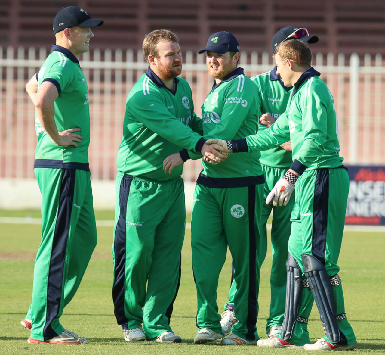 Paul Stirling gets a handshake from Niall O'Brien after claiming a wicket, Afghanistan v Ireland, 3rd ODI, Sharjah, December 10, 2017