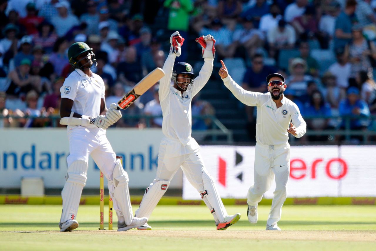 Virat Kohli and Wriddhiman Saha celebrate the wicket of Kagiso Rabada, South Africa v India, 1st Test, Cape Town, 1st day, January 5, 2017