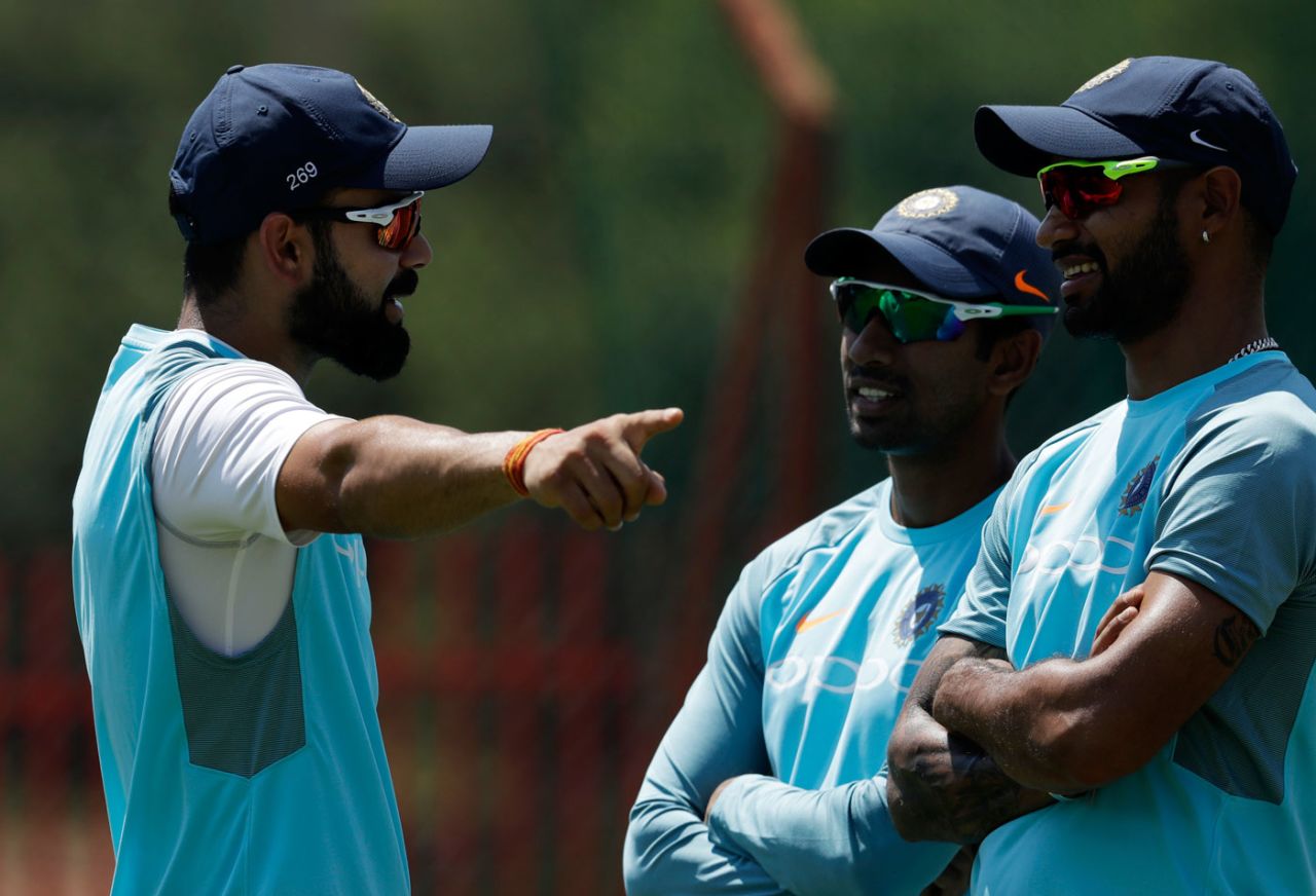 Virat Kohli has a chat with Wriddhiman Saha and Shikhar Dhawan during a nets session, South Africa v India, Centurion, January 12, 2018