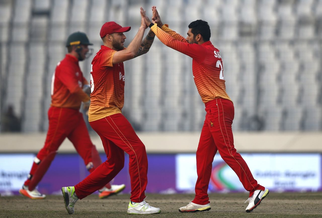 Sikandar Raza and Kyle Jarvis celebrate Anamul Haque's wicket, Bangladesh v Zimbabwe, tri-series, Mirpur, January 15, 2018