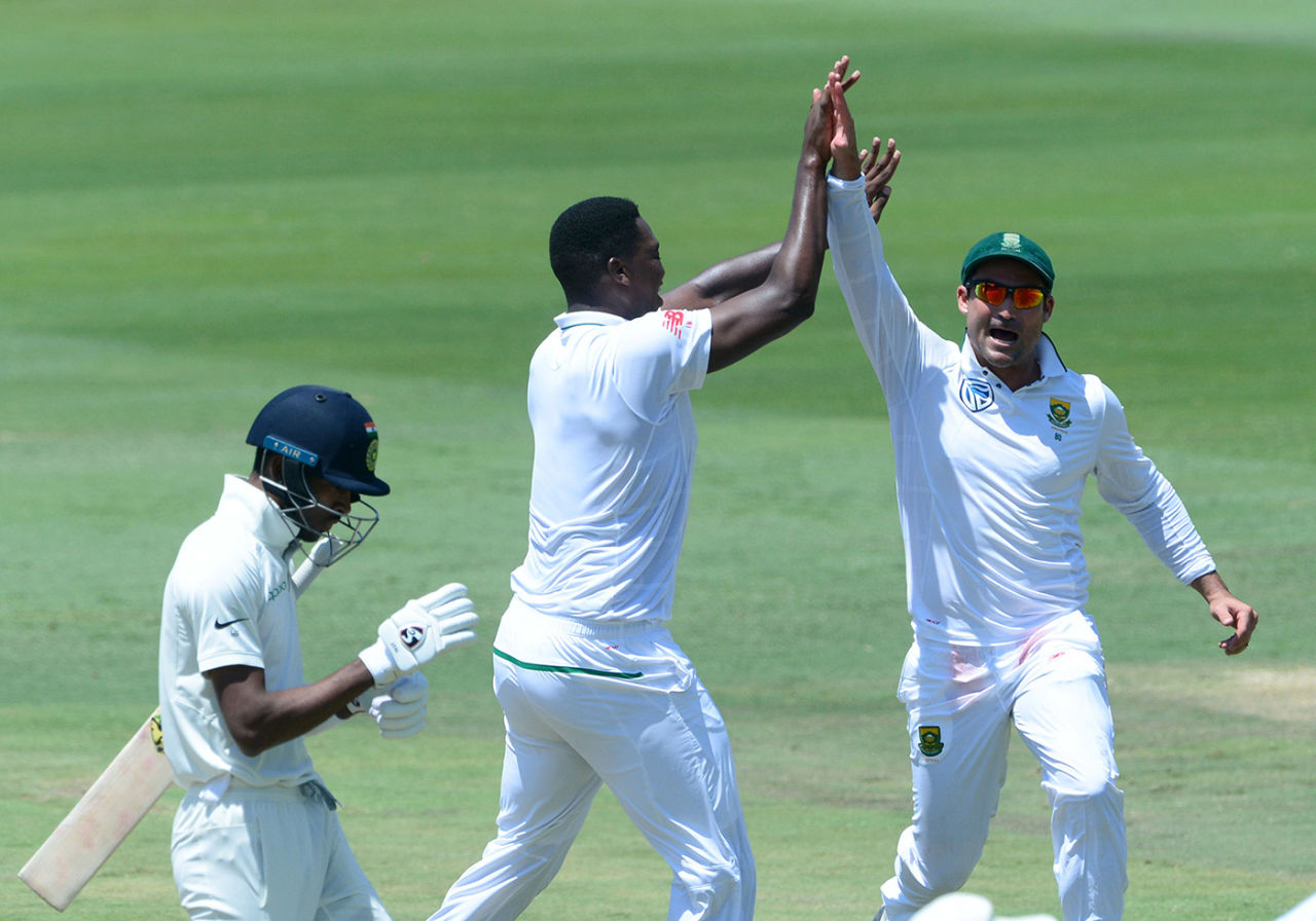 Lungi Ngidi and Dean Elgar celebrate the wicket of Hardik Pandya, South Africa v India, second Test, Centurion, day five, January 17, 2018