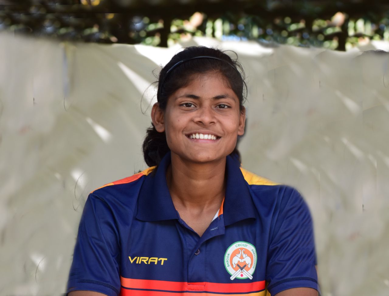 Baroda allrounder Radha Yadav sports a smile while watching a game at the Railways Cricket Ground, Mumbai v Andhra, Senior Women's One-day League 2017-18, Baroda, December 23, 2017