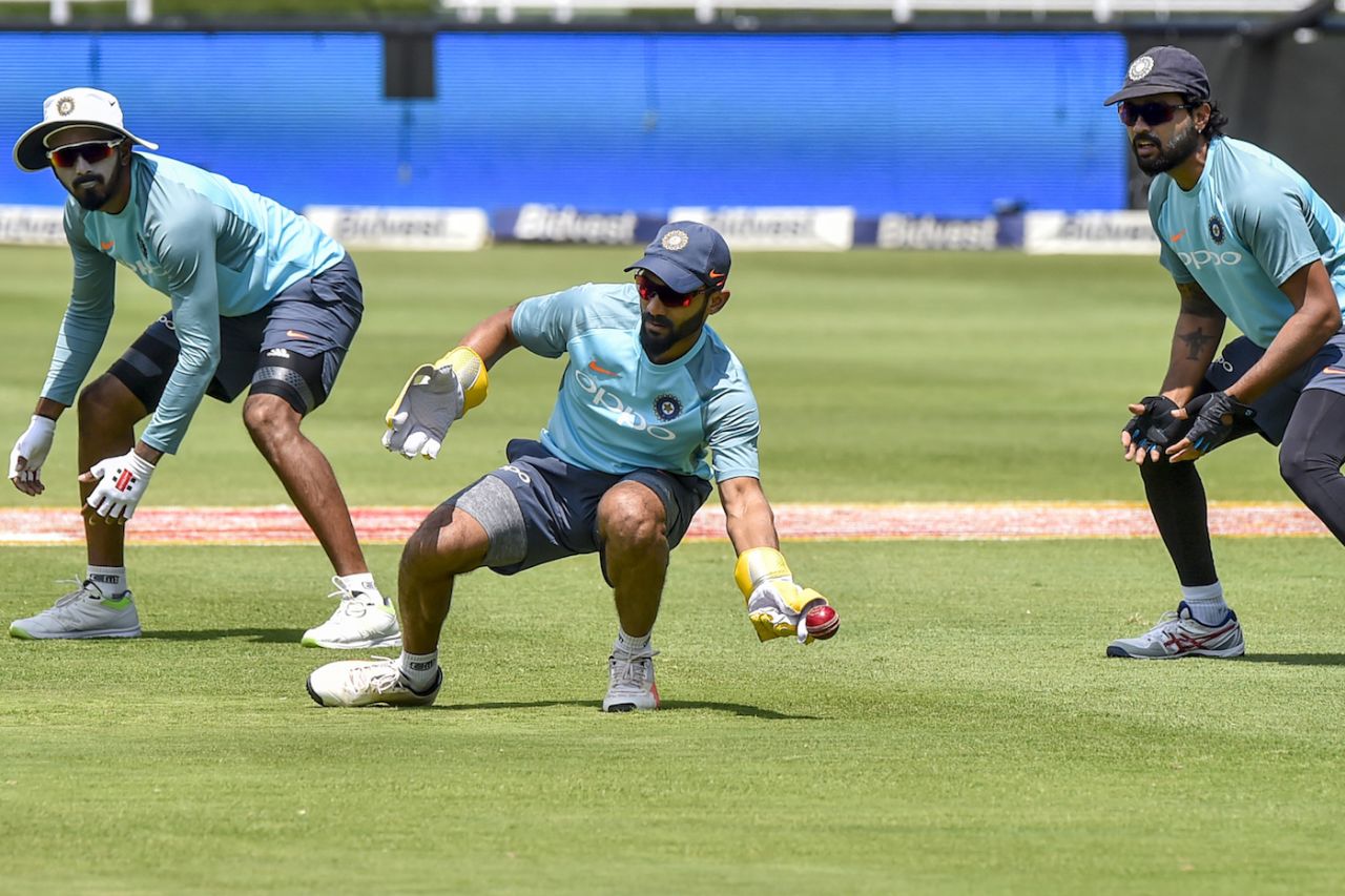 Dinesh Karthik attempts a catch in the presence of KL Rahul and M Vijay, Johannesburg, January 23, 2018