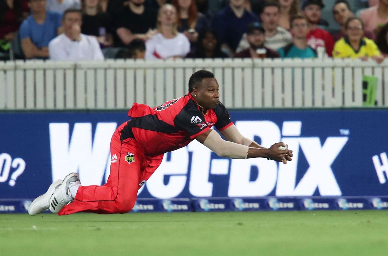 Kieron Pollard takes a diving catch in the deep, Sydney Thunder v Melbourne Renegades, BBL 2017-18, Canberra, January 24, 2018