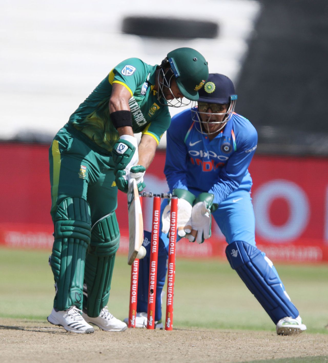 JP Duminy is bowled by Kuldeep Yadav while MS Dhoni looks on, South Africa v India, 1st ODI, Durban, February 1, 2018