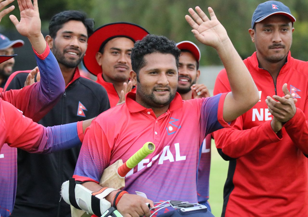 Basant Regmi walks off to applause from his team-mates after his 24 not out secured victory, Namibia v Nepal, ICC World Cricket League Division Two, Windhoek, February 8, 2018