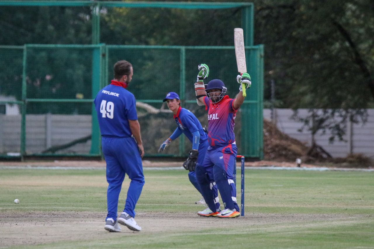 Basant Regmi raises his arms aloft after a leg-side wide clinches a one-wicket win, Namibia v Nepal, ICC World Cricket League Division Two, Windhoek, February 8, 2018