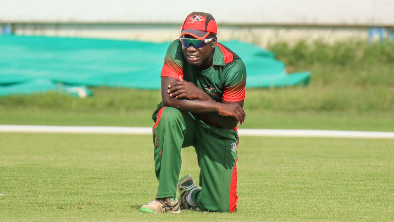 Shem Ngoche kneels alone on the outfield after misfielding the final ball of the match, Kenya v Nepal, ICC World Cricket League Division Two, Windhoek, February 12, 2018
