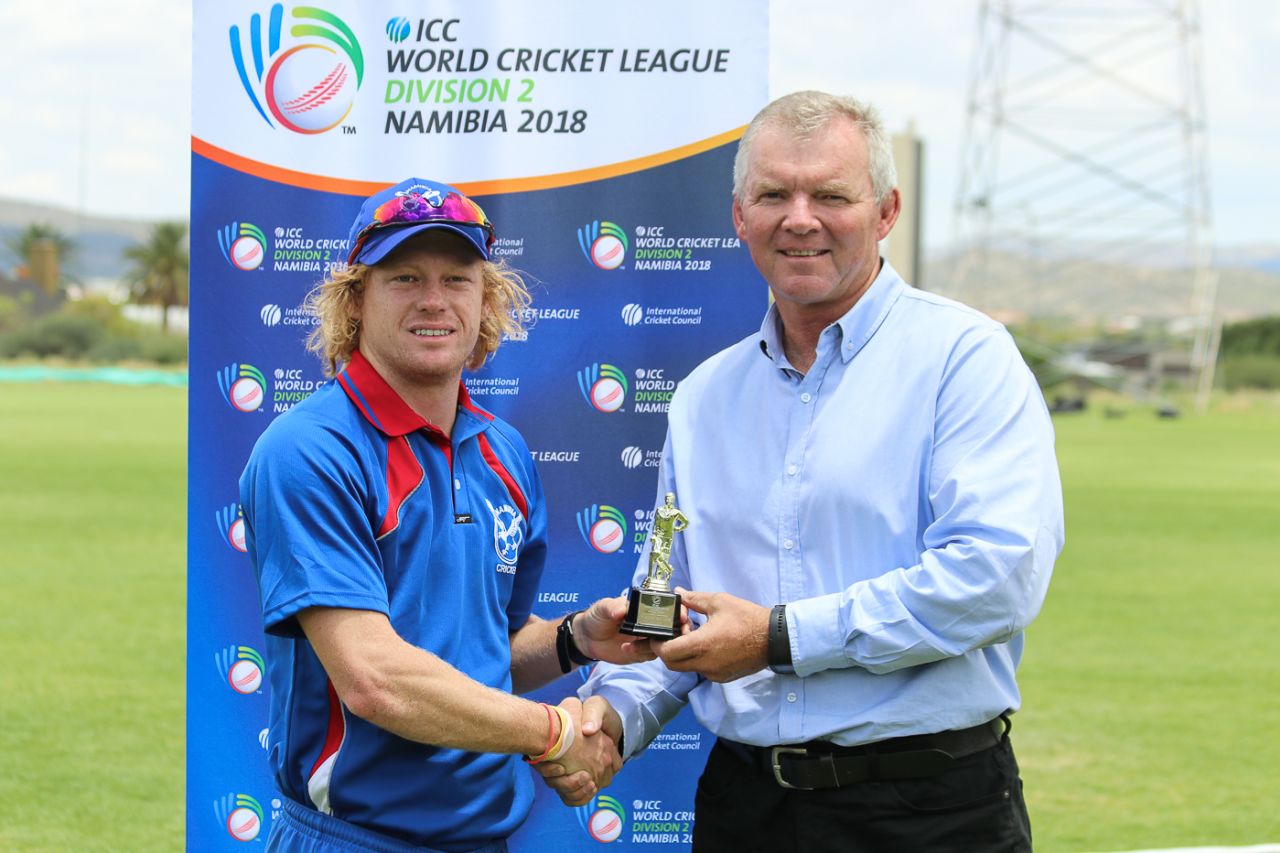 Bernard Scholtz accepts the Man of the Match award from ICC Associate board representative Francois Erasmus, Namibia v Kenya, ICC World Cricket League Division Two, Windhoek, February 13, 2018