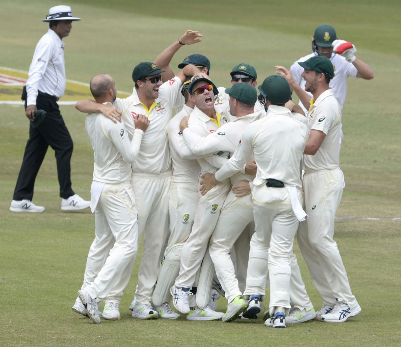 David Warner is engulfed after helping to run out AB de Villiers, South Africa v Australia, 1st Test, Durban, 4th day, March 4, 2018