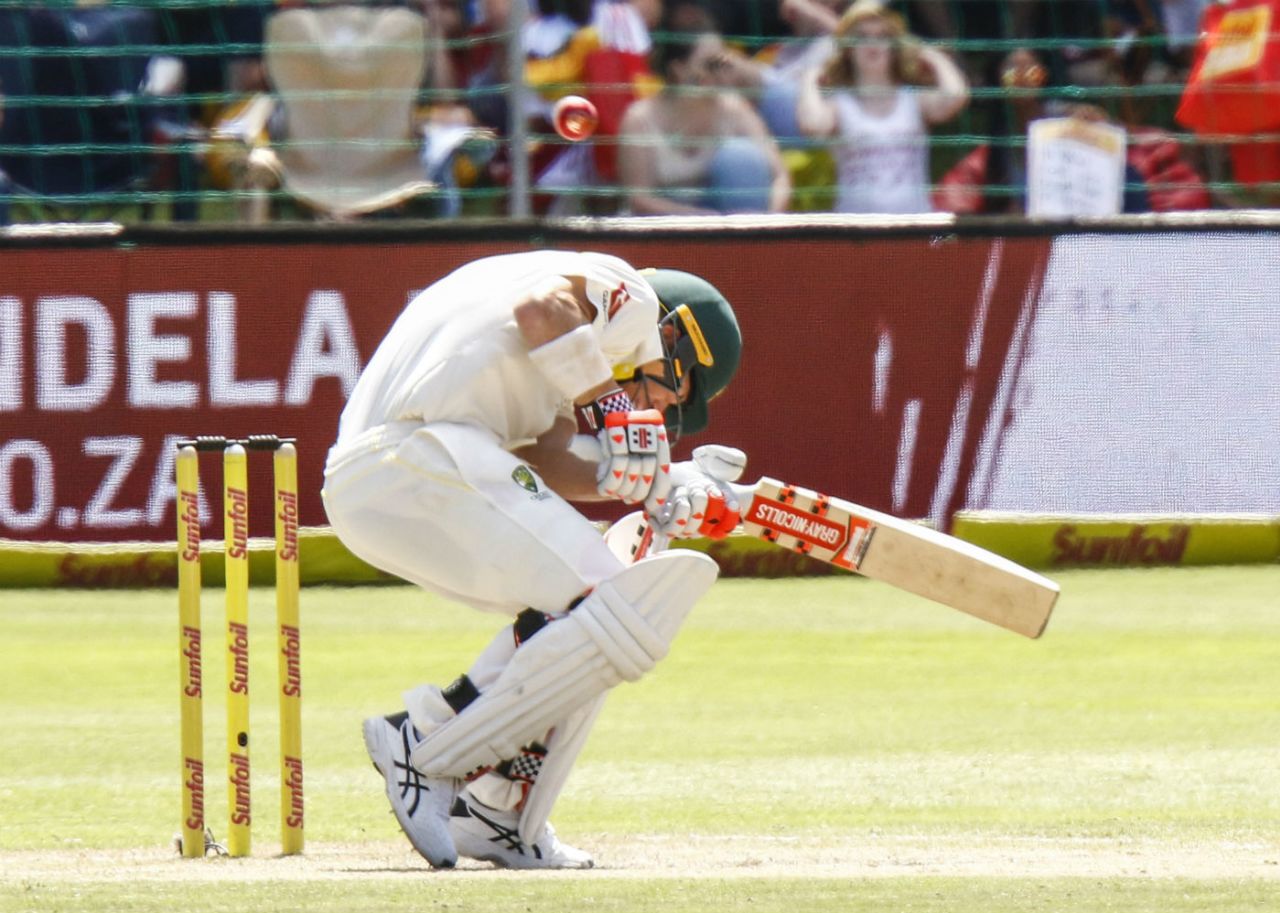 David Warner ducks under a fiery Kagiso Rabada bouncer, South Africa v Australia, 2nd Test, 3rd day, Port Elizabeth