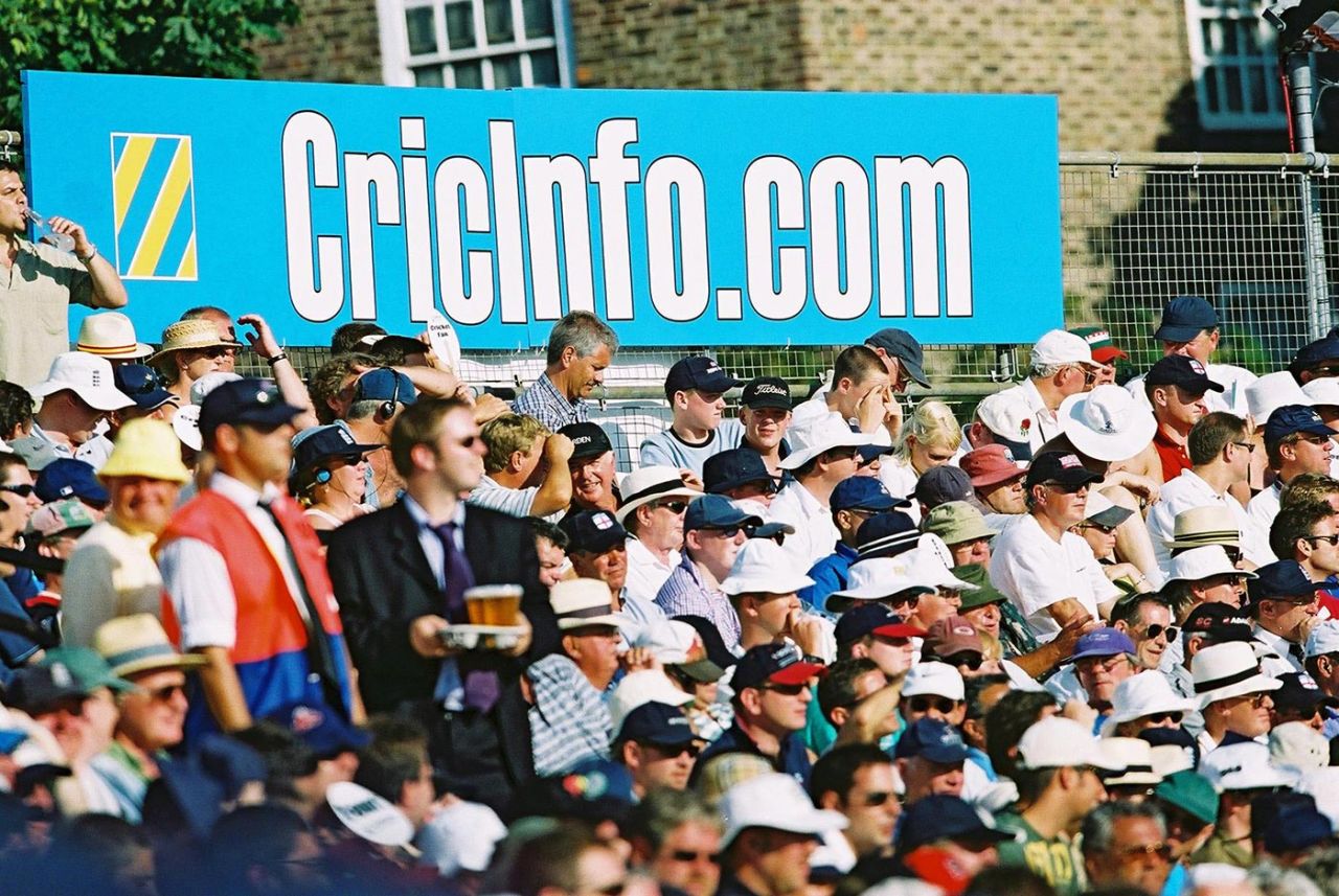 Fans watch the match against the background of a Cricinfo advert , England v Australia, 5th npower Ashes Test, day one, The Oval , August 23, 2001