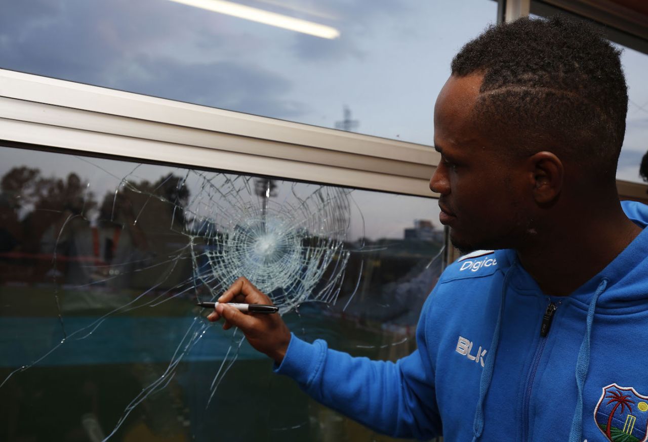 Marlon Samuels signs the window he broke, Zimbabwe v West Indies, World Cup Qualifiers, Harare, March 19, 2018