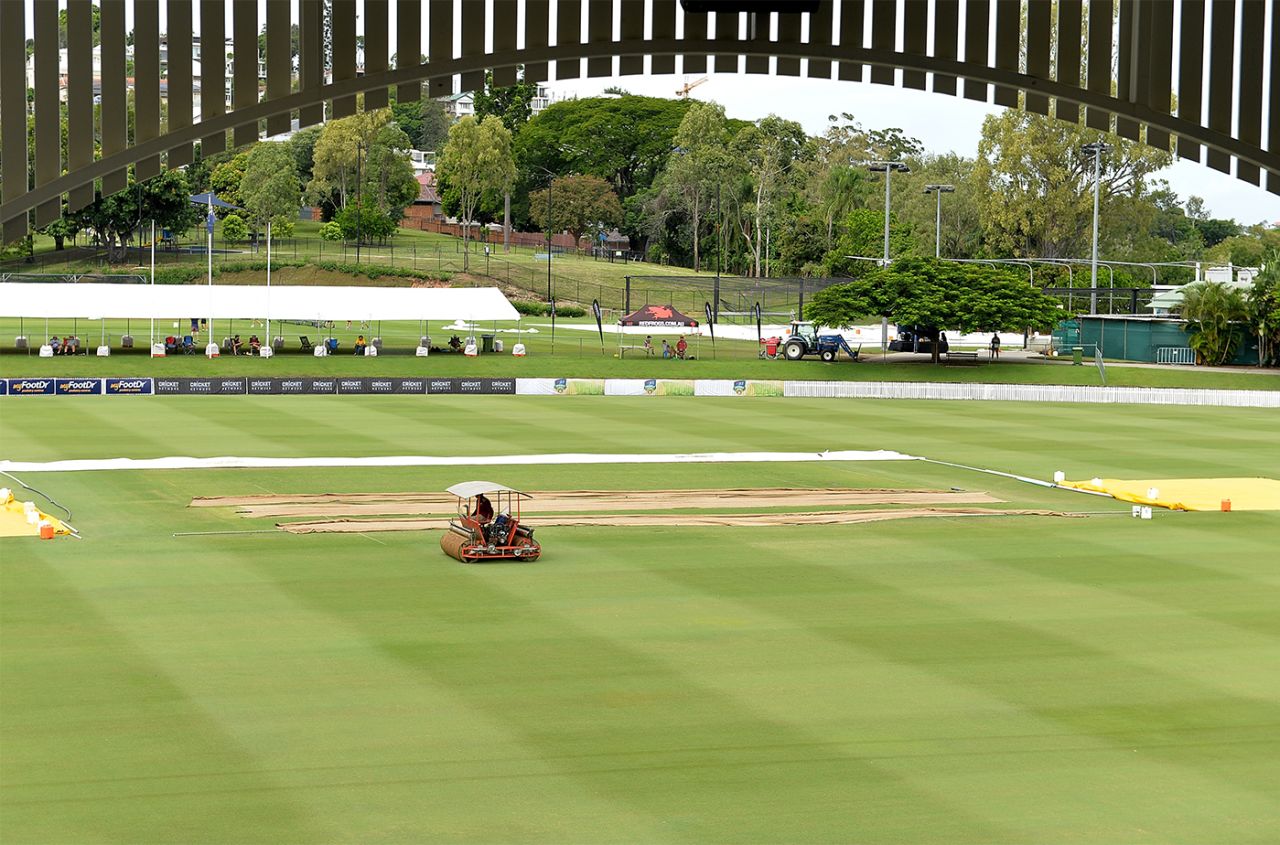 A member of the ground staff works on the Allan Border Field outfield, Queensland v Tasmania, Sheffield Shield 2017-18, final, Brisbane, 1st day, March 23, 2018