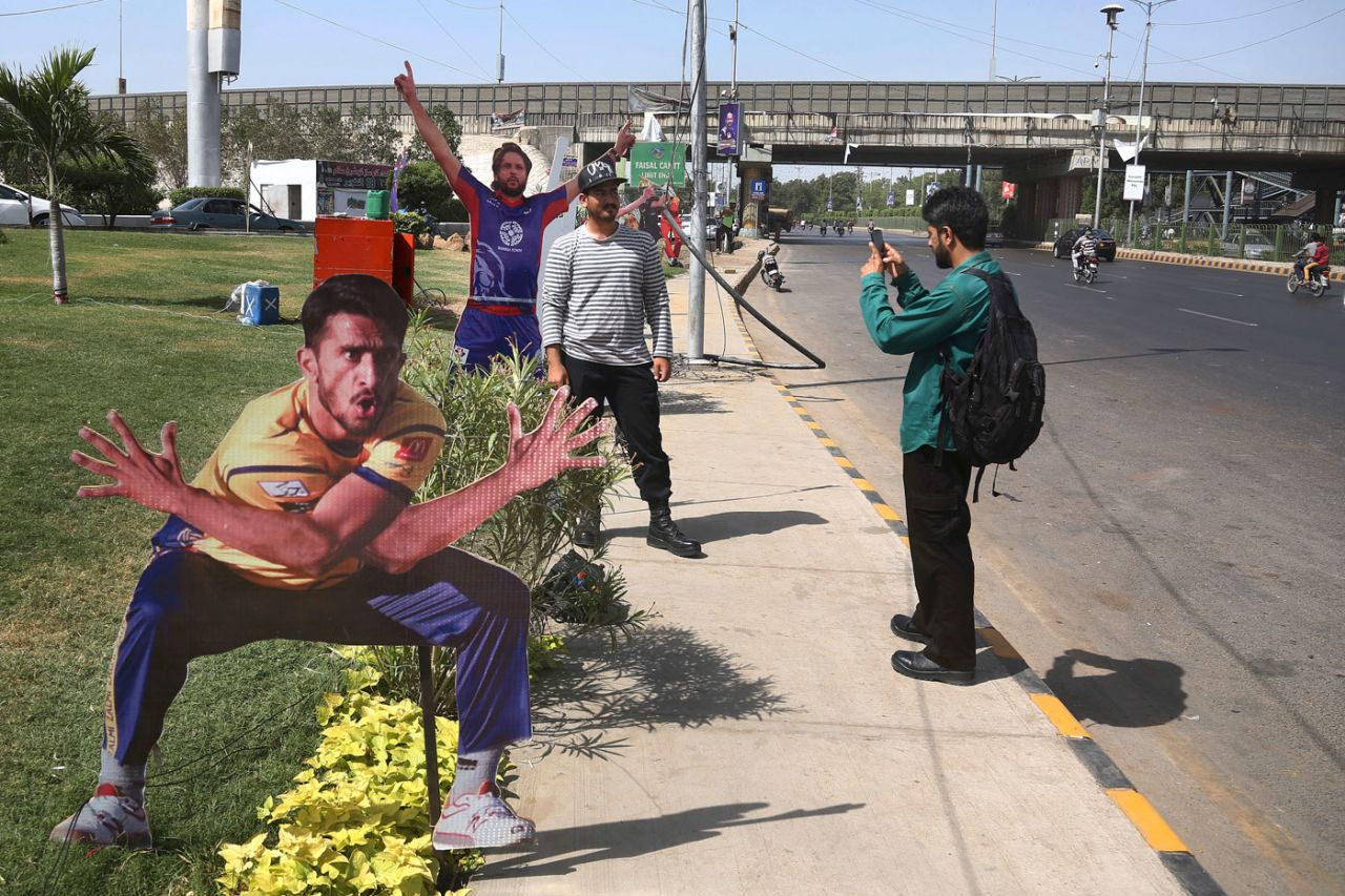 Fans pose next to cut-outs of Hasan Ali and Shahid Afridi ahead of the final, Pakistan Super League, March 24, 2018