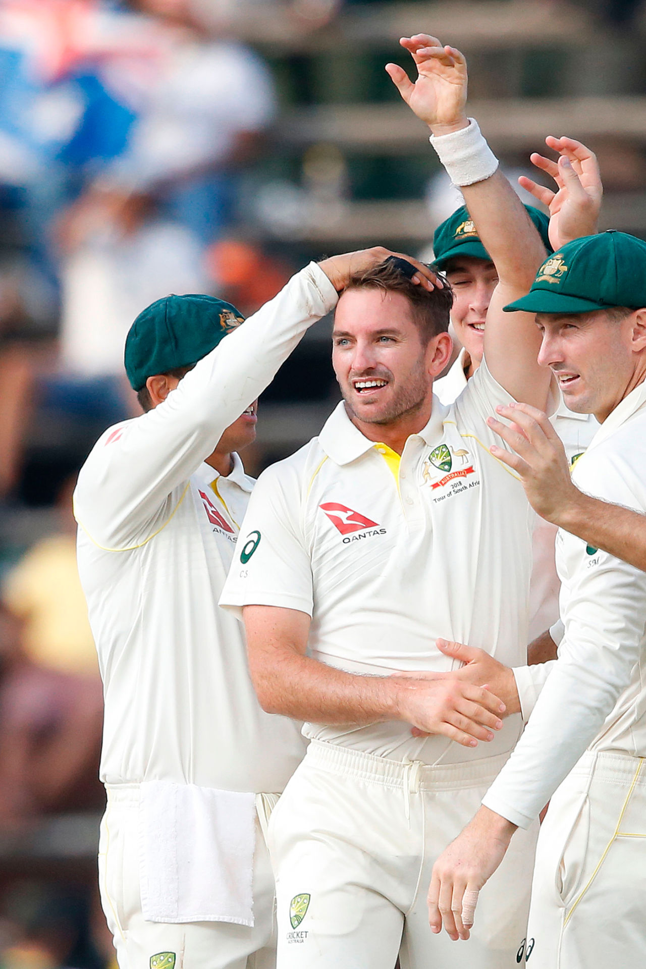 Chadd Sayers is mobbed by his team-mates after picking up his first Test wicket, South Africa v Australia, 4th Test, Johannesburg, 1st day, March 30, 2018