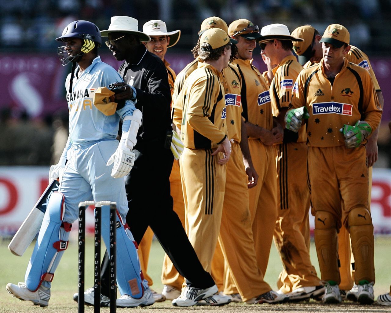 Umpire Steve Bucknor leads Harbhajan Singh away after the batsman got into an argument with the Australians, India v Australia, 1st ODI, Bangalore, September 29, 2007
