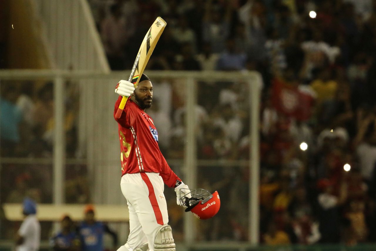 Chris Gayle raises his bat upon reaching his 21st T20 century, Kings XI Punjab v Sunrisers Hyderabad, IPL 2018, Mohali, April 19, 2018