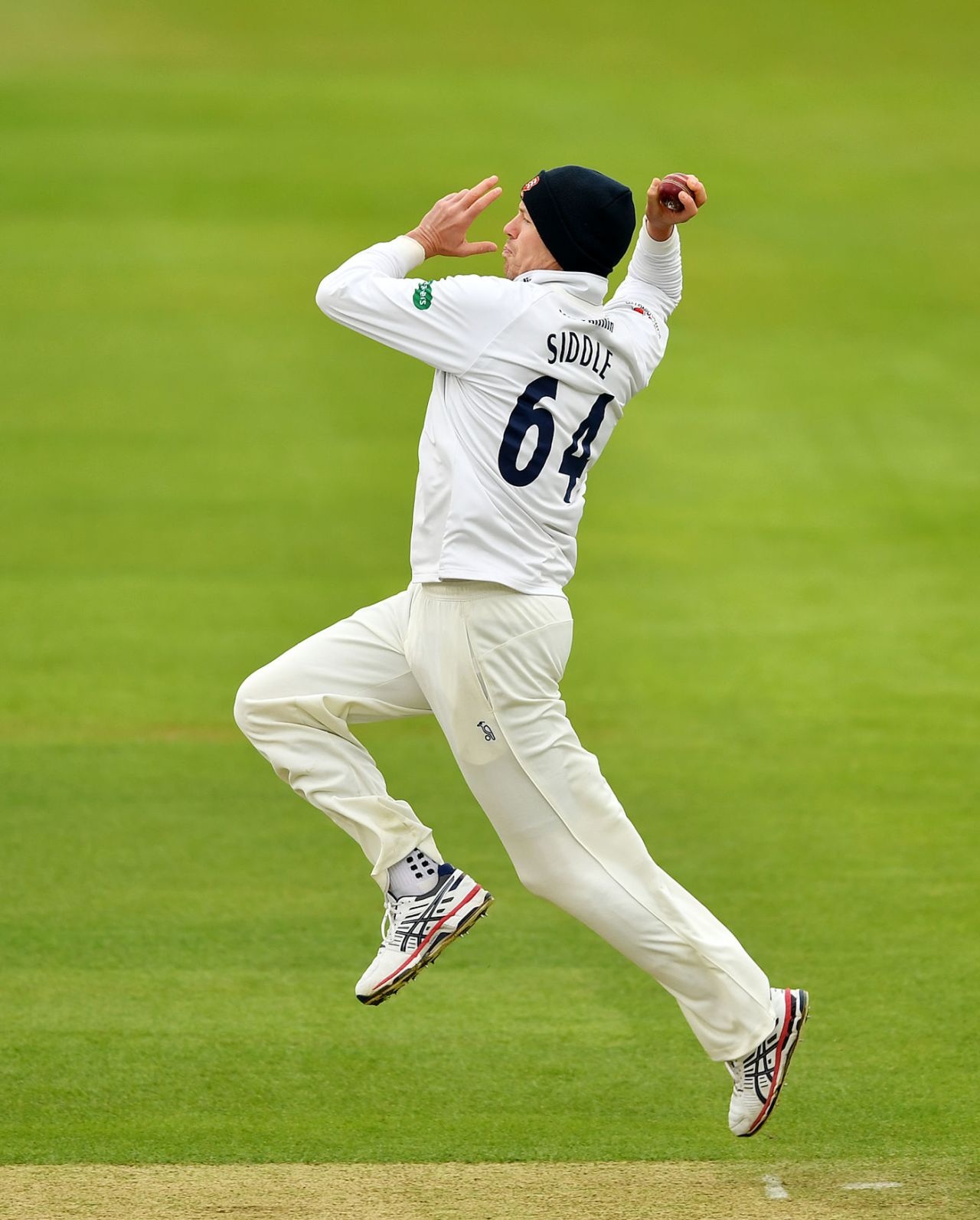 Peter Siddle protects himself against the cold, Hampshire v Essex, Specsavers Championship Division One, Ageas Bowl, April 30, 2018
