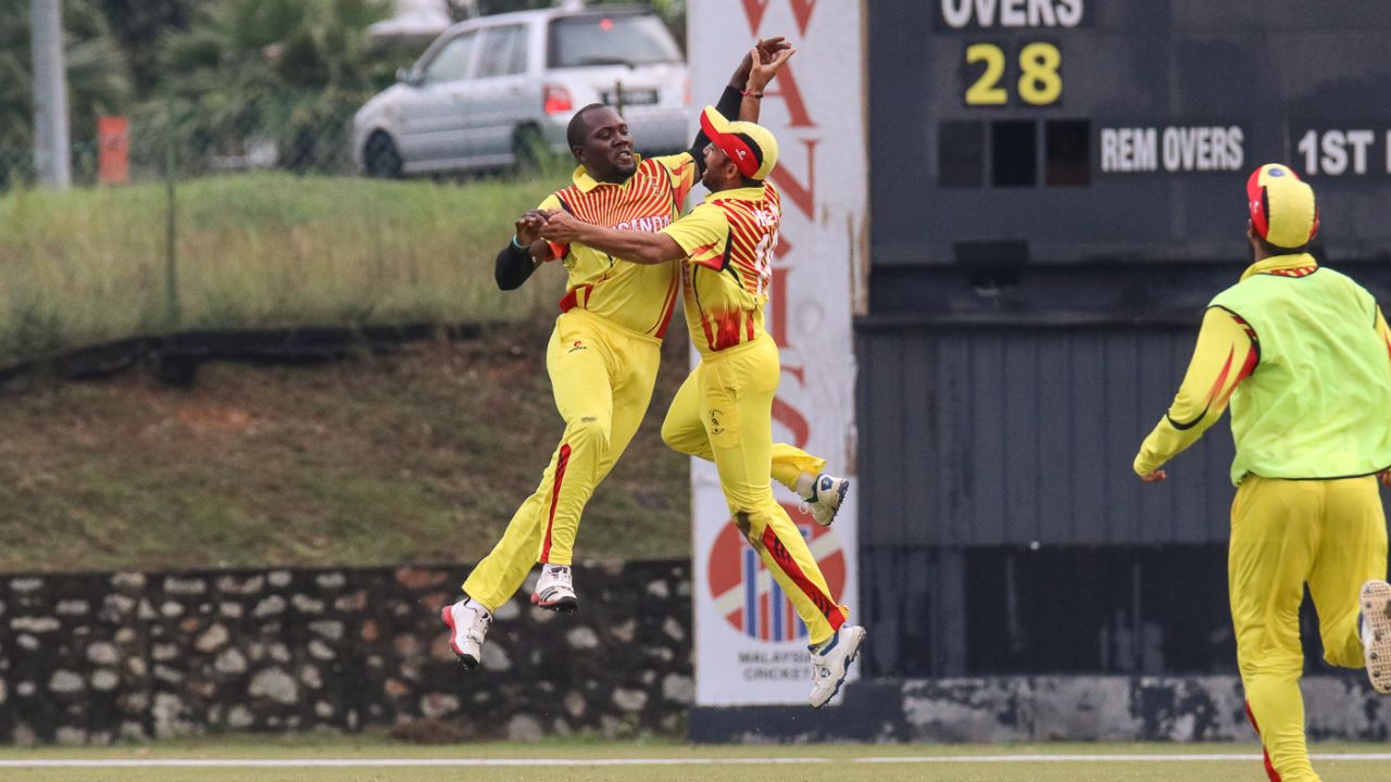 Uganda captain Roger Mukasa and Irfan Afridi leap for joy after a thrilling last-ball win, Denmark v Uganda, ICC World Cricket League Division Four, Kuala Lumpur, May 3, 2018
