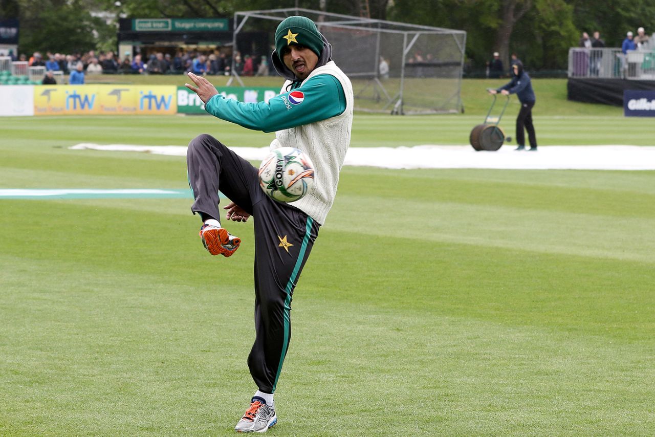 Saad Ali kicks a football around with his team-mates during a rain delay, Ireland v Pakistan, Only Test, Malahide, 1st day, May 11, 2018