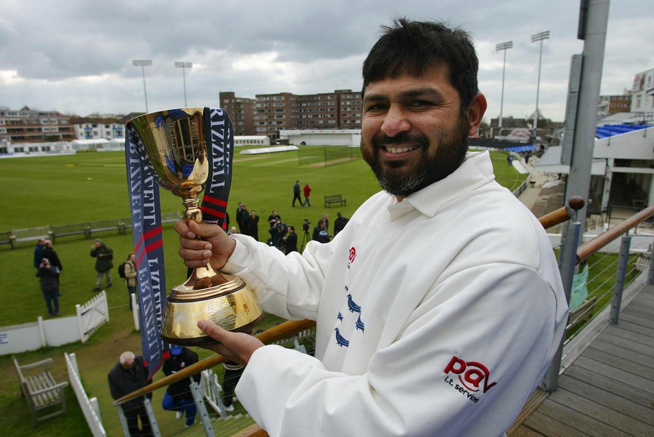 Mushtaq Ahmed shows off the County Championship trophy from Sussex's 2003 County Championship win, Hove, April  7, 2004
