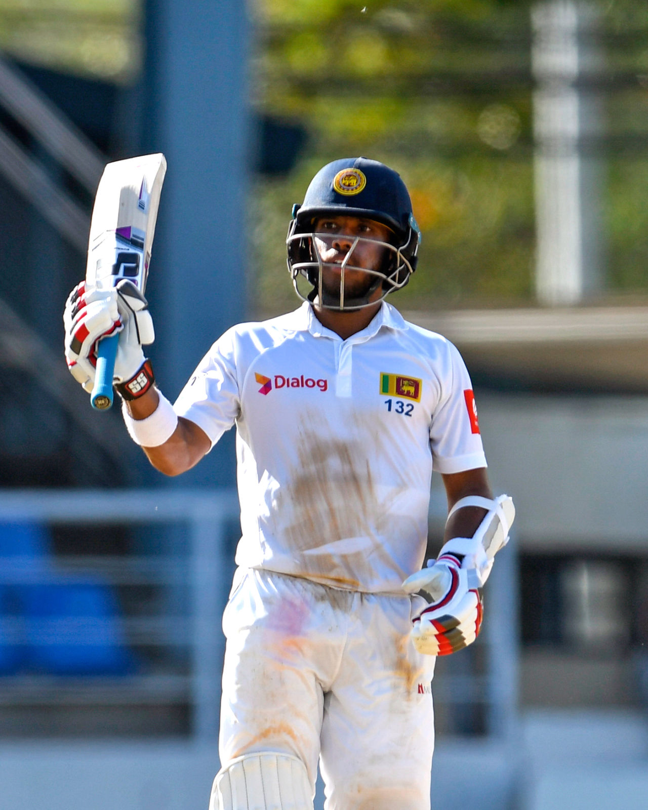 Kusal Mendis raises his bat after getting to his fifty, West Indies v Sri Lanka, 1st Test, Port of Spain, 4th day, June 9, 2018